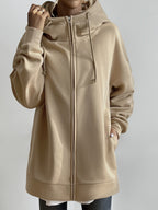 Sudadera larga de mujer con capucha y cremallera – corte oversize y bolsillos laterales